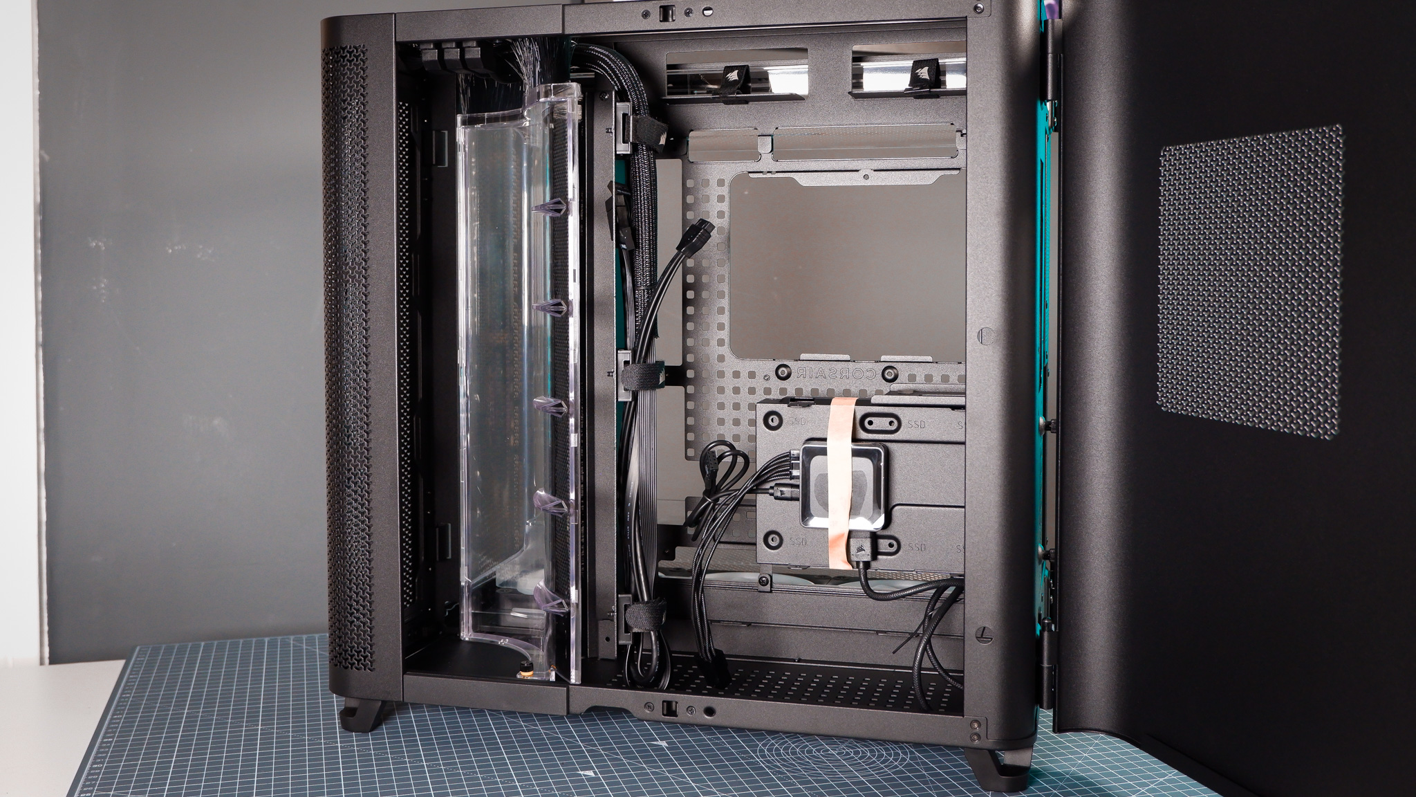 A Corsair Air 5400 PC case on a desk with various parts installed.