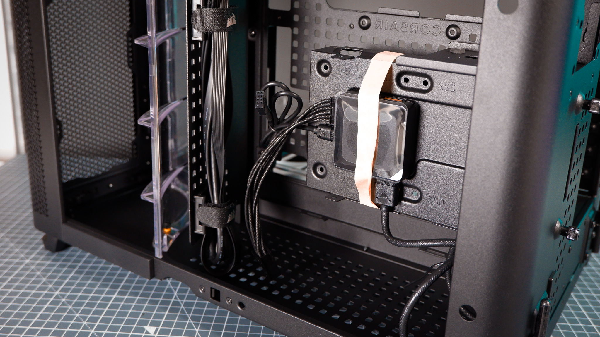 A Corsair Air 5400 PC case on a desk with various parts installed.