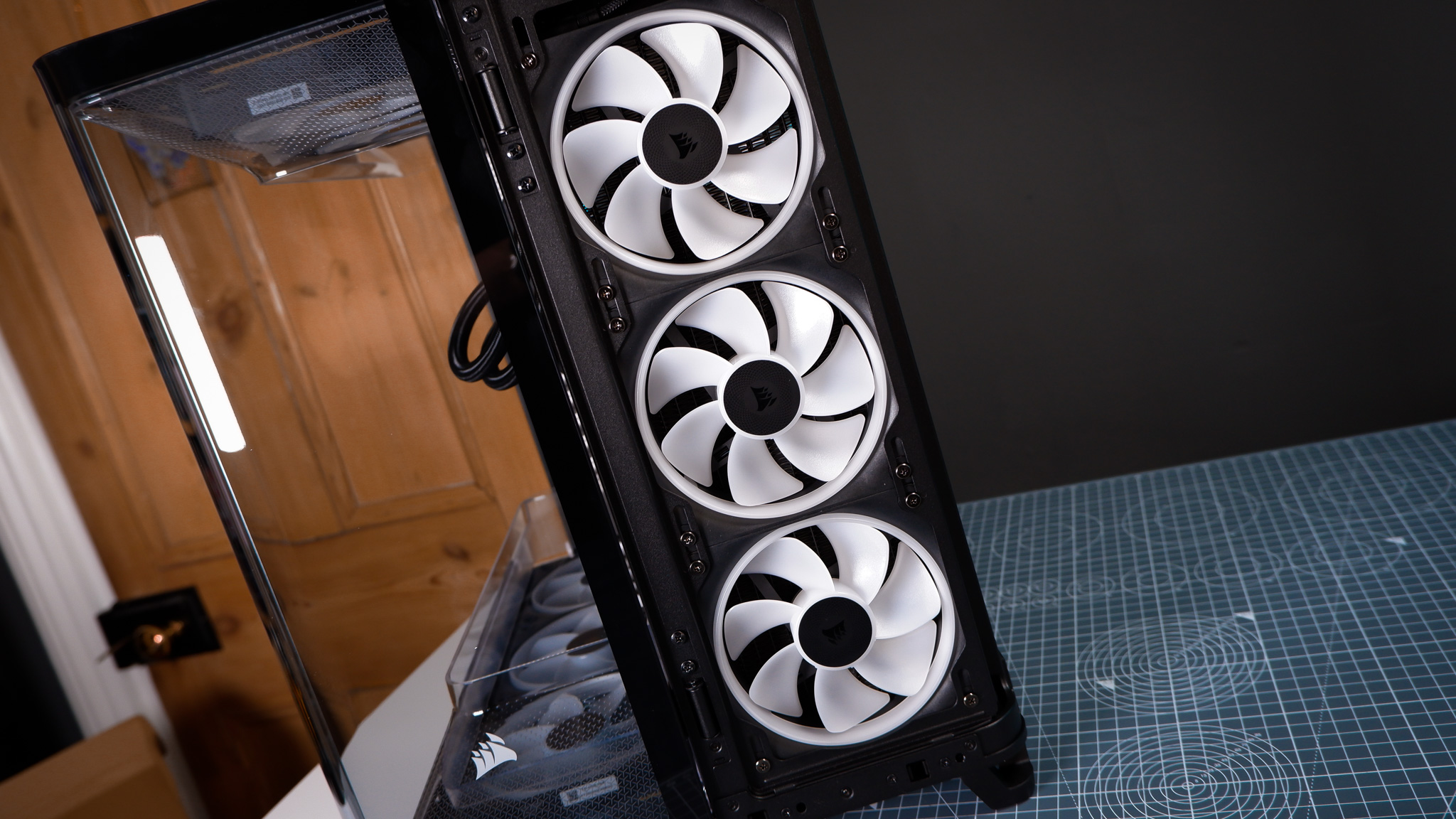 A Corsair Air 5400 PC case on a desk with various parts installed.