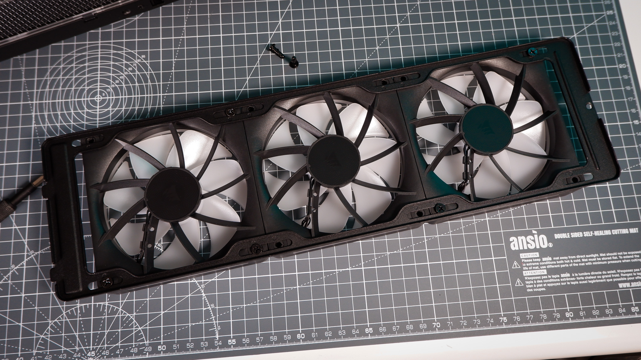 A Corsair Air 5400 PC case on a desk with various parts installed.