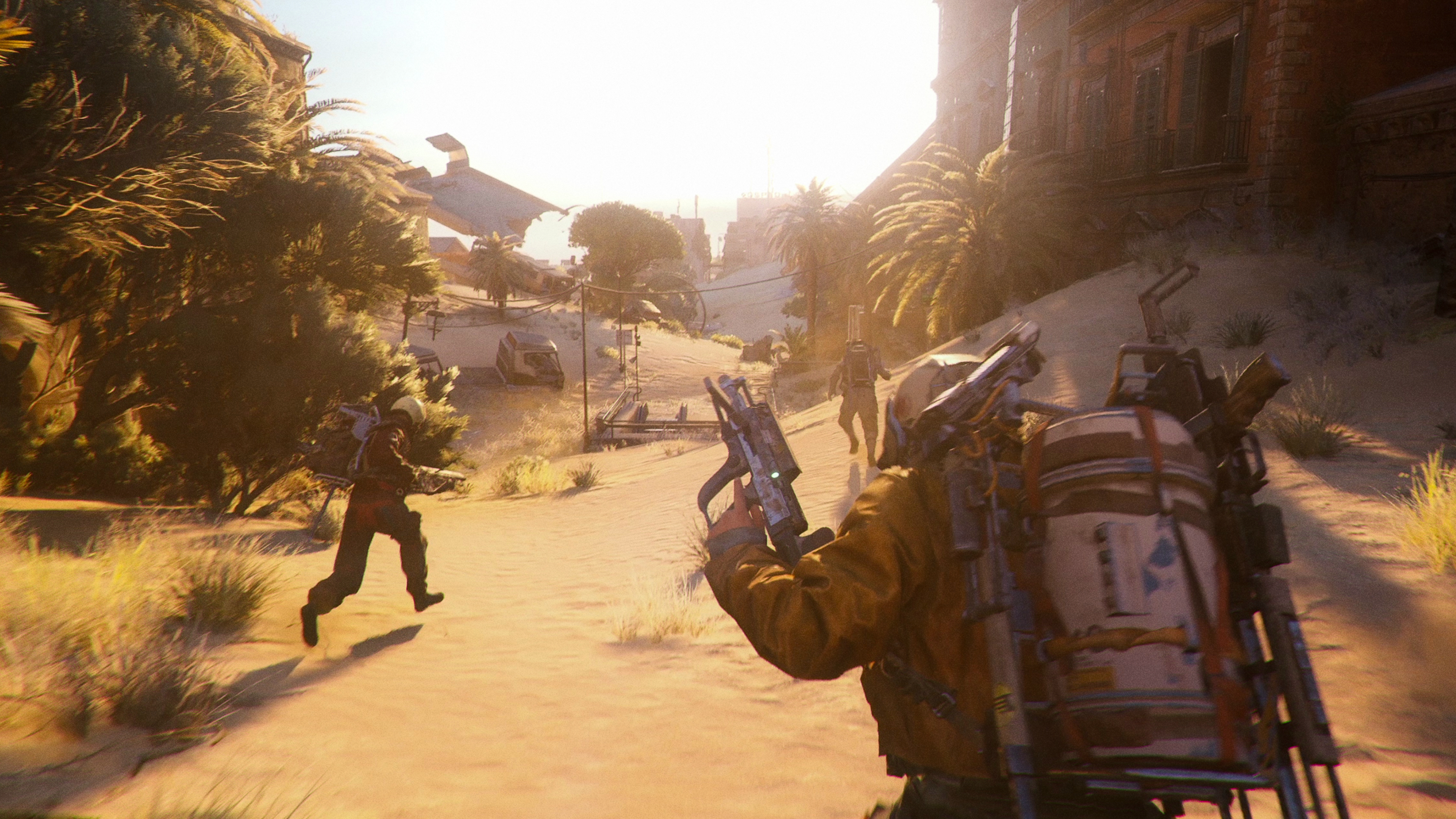 Arc Raiders olive locations: Three raiders running with guns in their hands through Buried City, an urban environment flooded with sand.