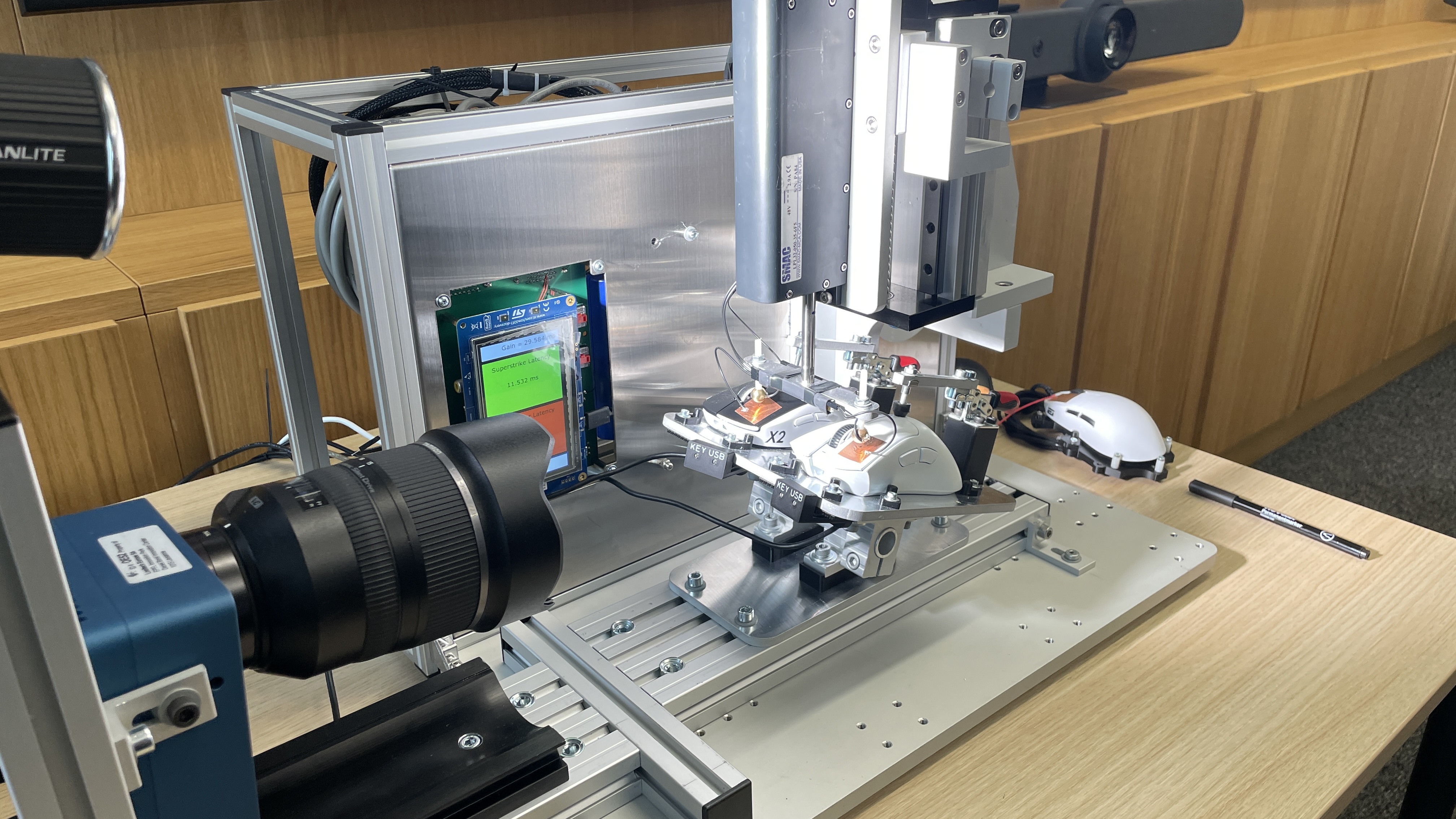 A bespoke high precision actuator machine at Logitech HQ used for testing click latency, here testing the G Pro X2 Superstrike compared to a competitor.