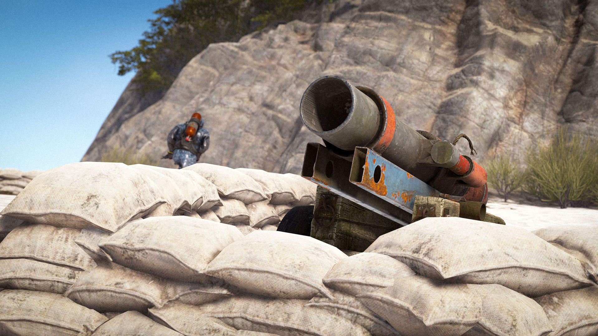 A makeshift cannon surrounded by sandbags in Rust