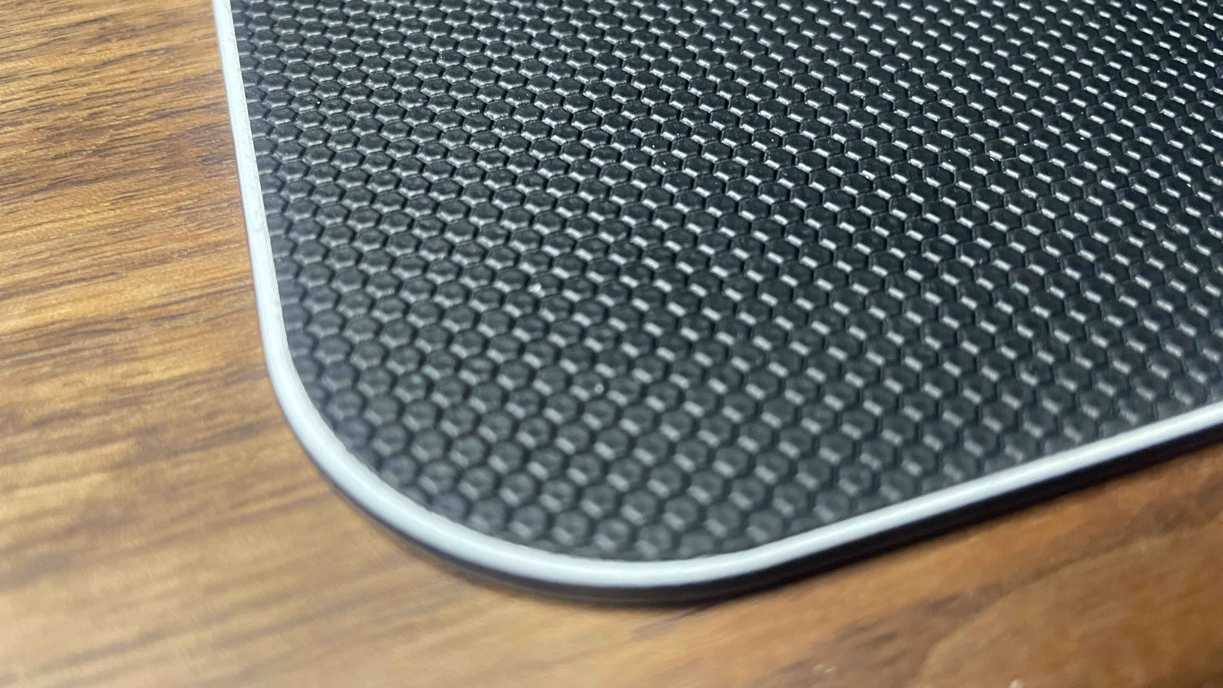 A QPAD Obsidian Glass mouse pad.