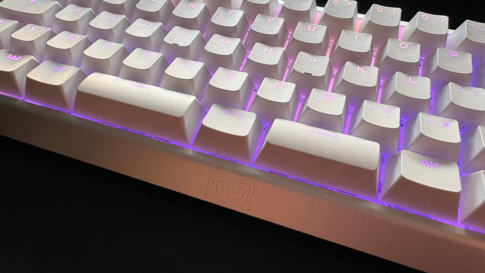 The Wooting 60HE v2 with a split spacebar in white and with RGB lighting enabled.