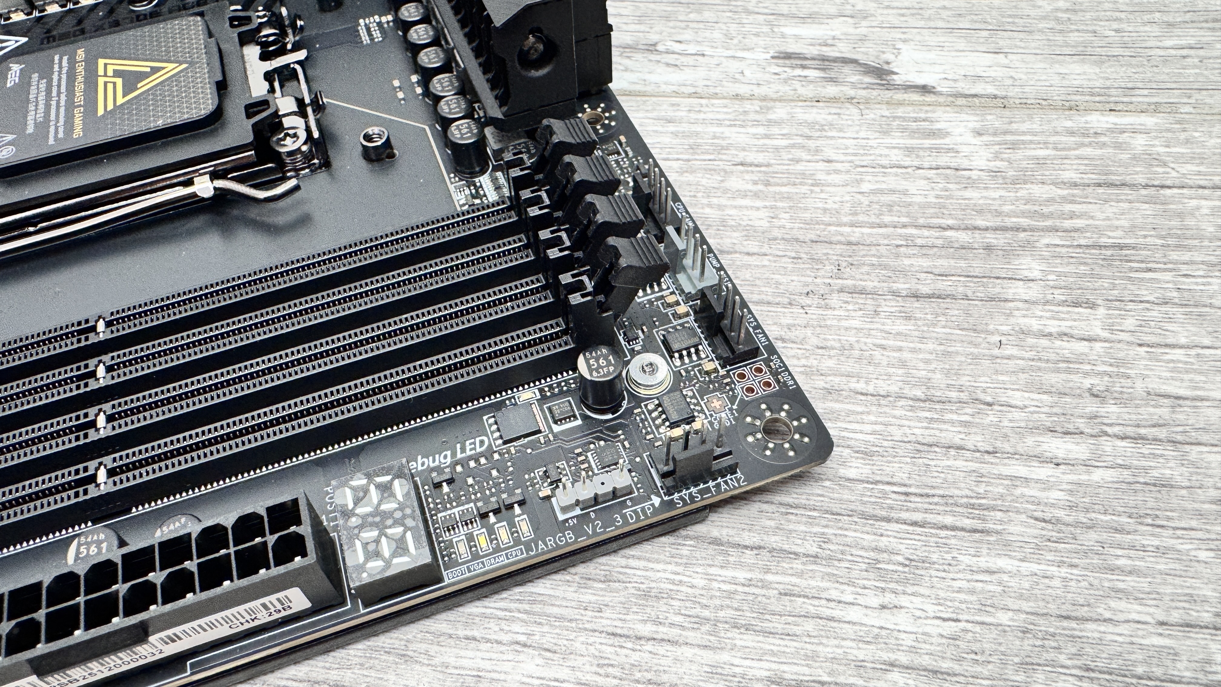 An MSI MEG X870E Ace Max motherboard on a desk.