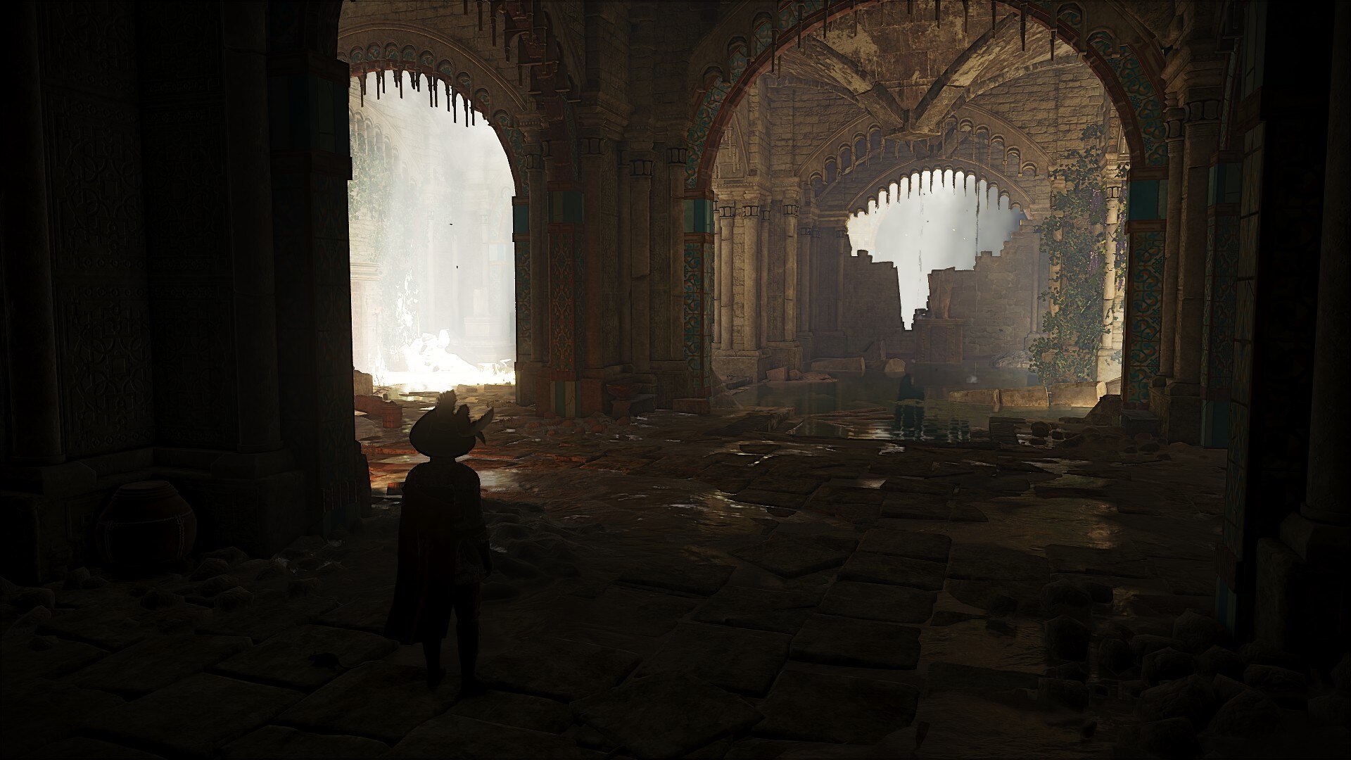 A figure stands in a mysterious underground chamber