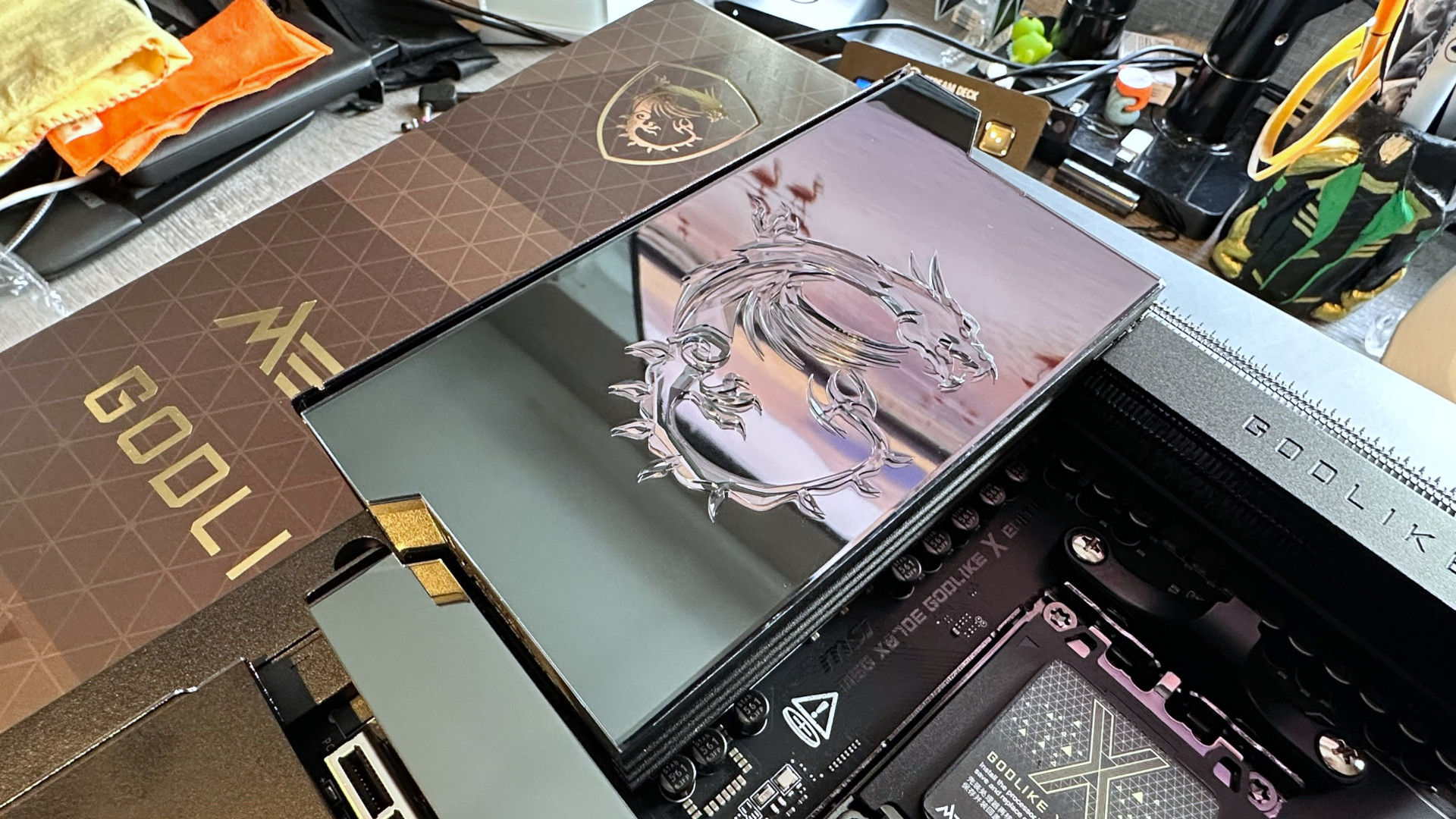 A photo showing the photochromic display on an MSI MEG X870E Godlike X Edition motherboard