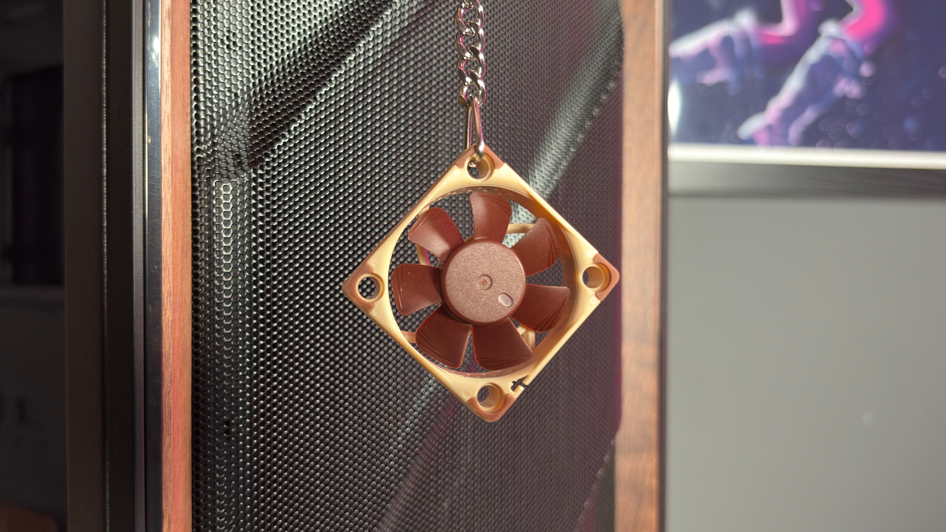 The Antec Flux Pro Noctua Edition on a desk with various parts disassembled.