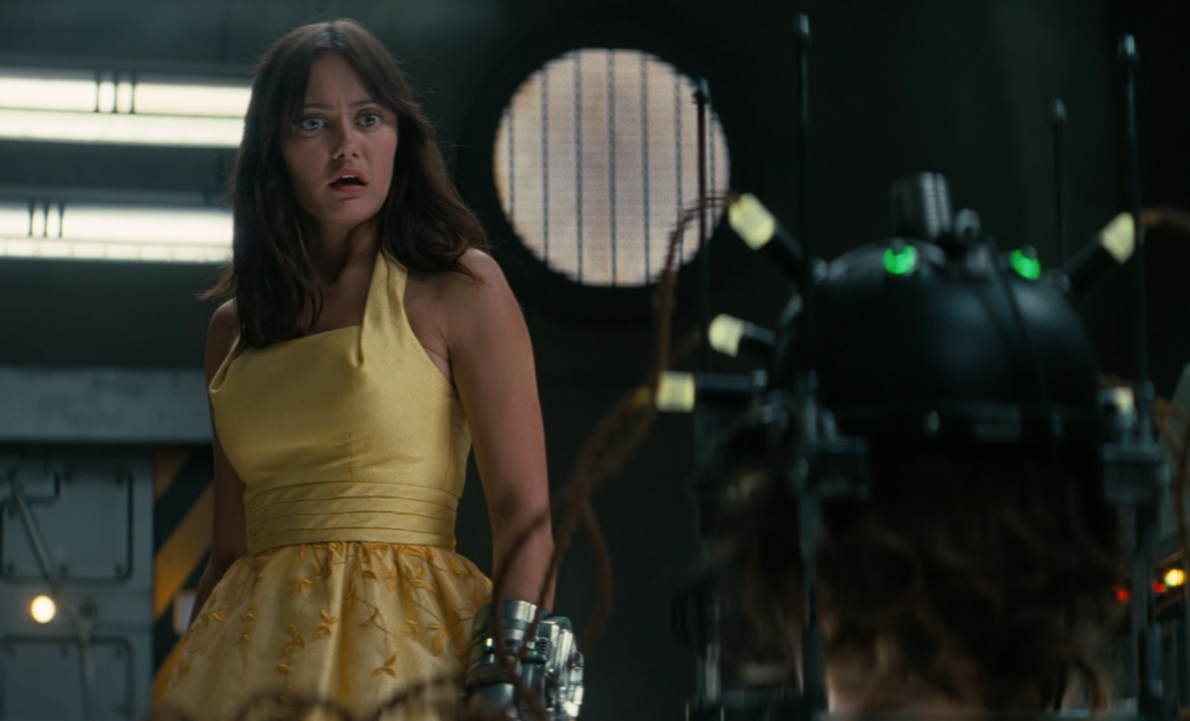 Lucy looking in horror at a head in a jar