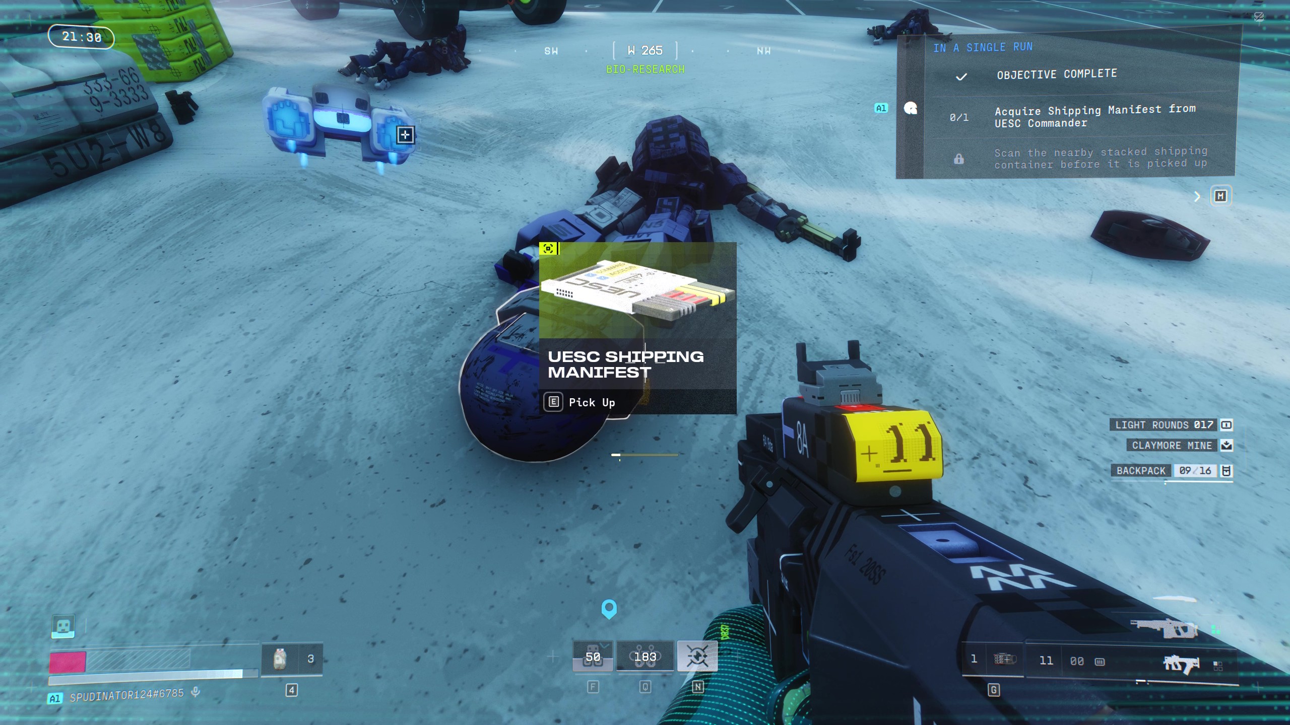 Marathon Introducing Traxus: A player looking at the UESC Shipping Manifest quest item on the ground, next to a robot's body.