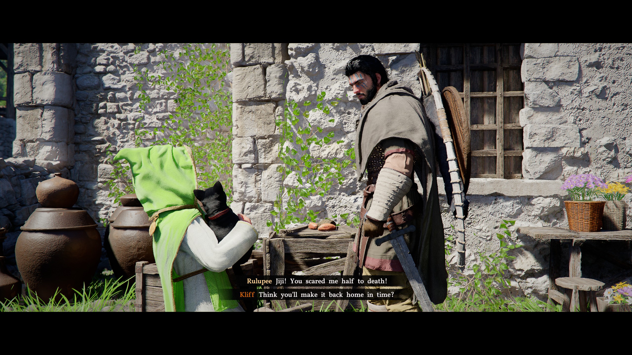 A child in a green hood carries a black cat, Kliff looking down at them.