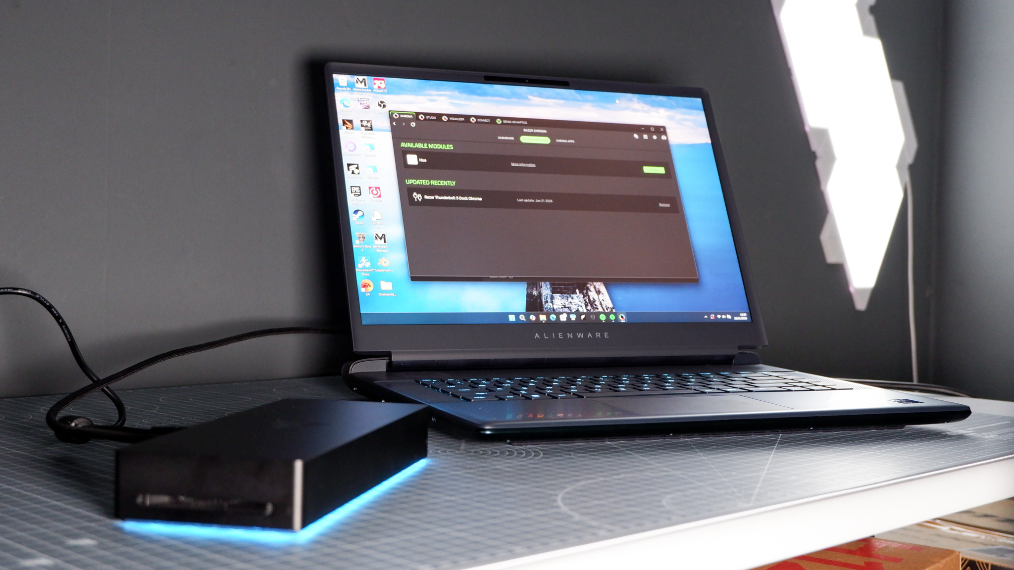 The Razer Thunderbolt 5 Dock on a desk with the RGB enabled and an SSD installed.