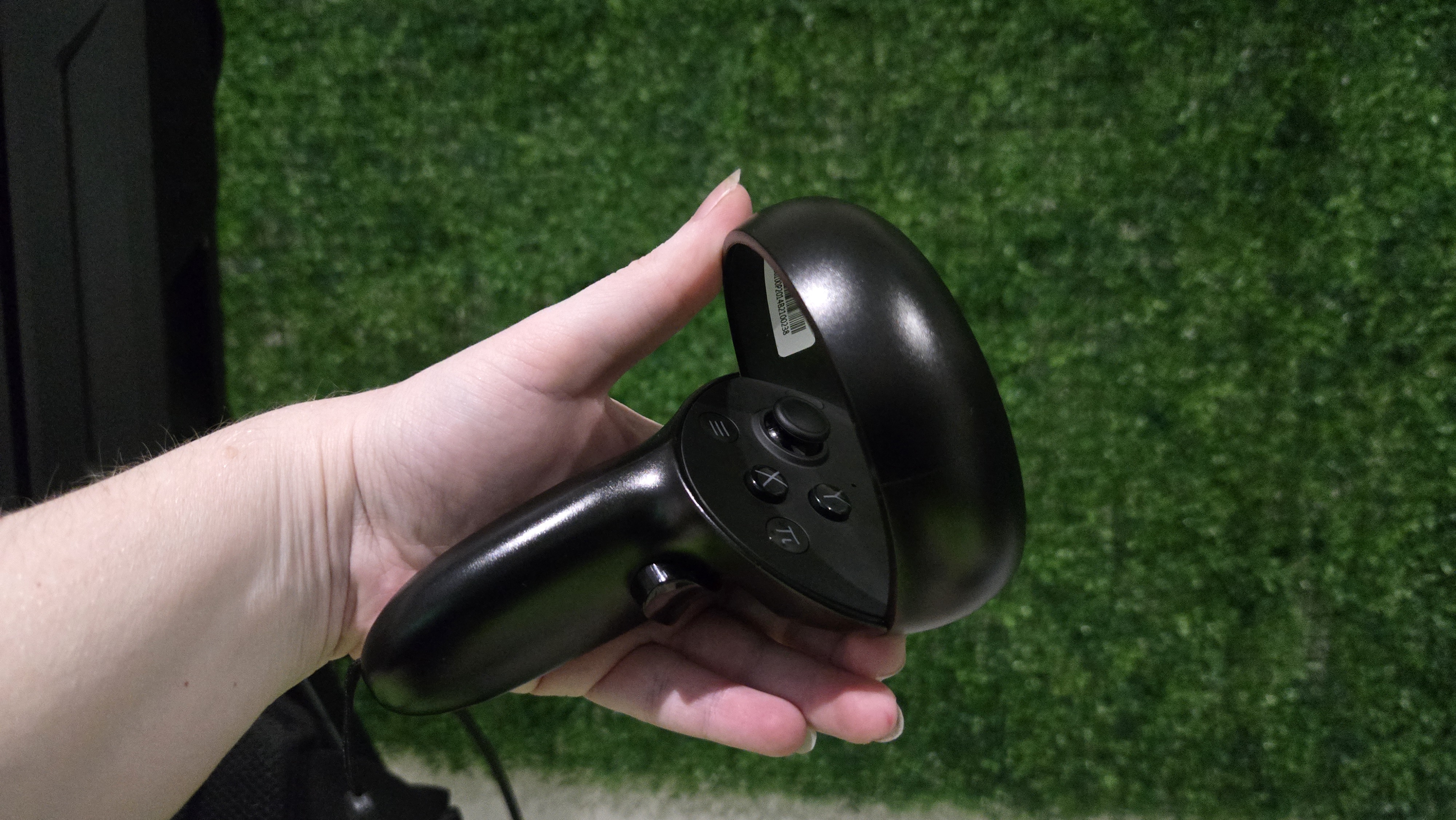 A Pimax Crystal Super virtual reality headset on a green background.