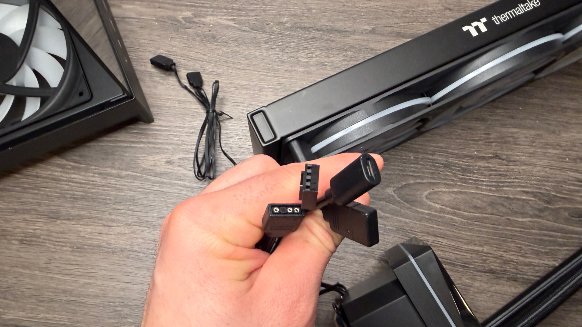 Thermaltake TH360 V3 Ultra ARGB Sync outside of a PC case with fans installed.