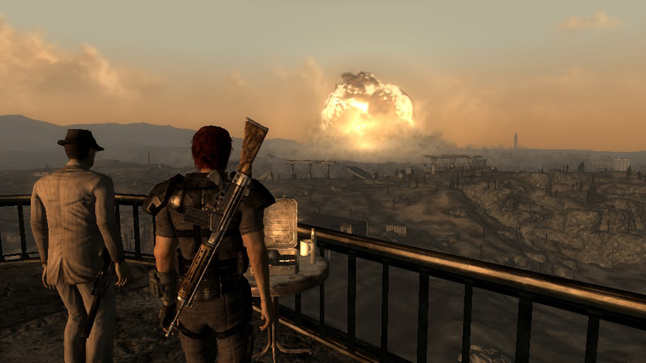 The player and an NPC watch as Megaton explodes in Fallout 3.